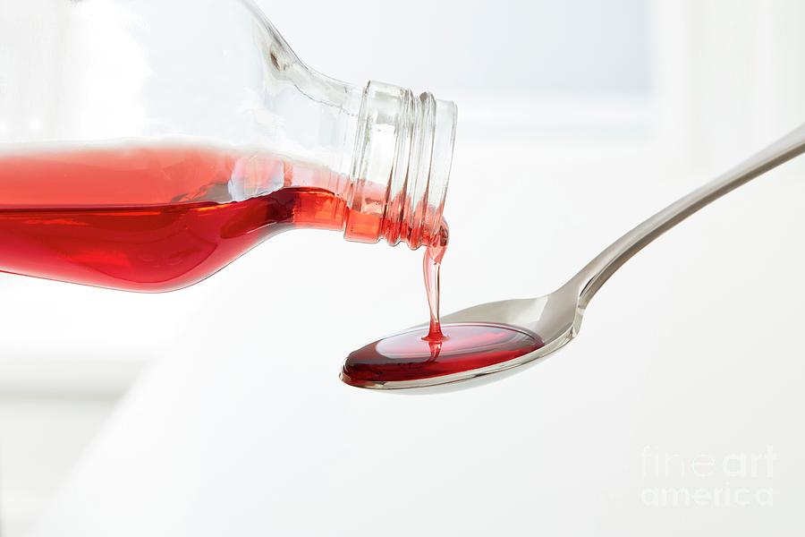 cough-syrup-pouring-onto-a-spoon-science-photo-library